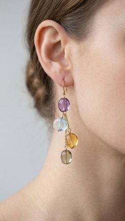 Angel Falls cascade earrings 14ct gold with natural amethyst, blue topaz, citrine and lemon quartz worn on model