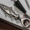 Essential kit for quenching thirsts in the fishing hut: fine English pewter trout bottle opener