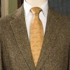 Gold silk crossed shotgun tie