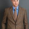 The new season's jackets: the elegantly tailored brown herringbone with blue overcheck