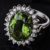 Exceptional vivid peridot, diamond and 18ct gold ring