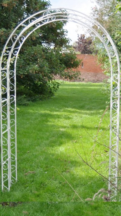 Ascalon Design Rustic Arch in cream: the perfect archway for profusions of clematis and roses to add interest to a garden vista