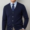 Massoti navy classic V-neck cardigan in extrafine Australian Merino wool, modelled