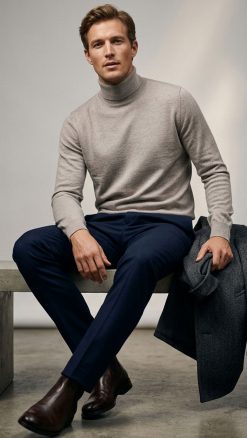 Massoti roll-neck jumper in natural beige extrafine Australian Merino wool, modelled at CountryClubuk.