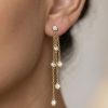 Effy New York 14ct gold diamond chain drop earrings with bezel-set natural diamonds worn on ear