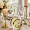 Hand-blown Artland Sommelier wine cooling carafe with chilled white wine and ice at a luxury summer table setting