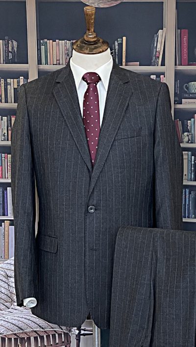 Smart, well cut charcoal pinstripe suit in pure wool by the fine tailors Magee of Donegal: hand stitched and supremely well tailored