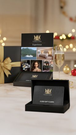 CountryClubuk black gift box with gold ribbon containing luxury gift voucher £250–£10,000 – Savoy, Orient-Express & Regent Seven Seas at Member rates