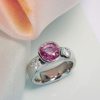 Natural Ceylon pink sapphire 2.65 carats, cushion cut; diamonds 0.40 carats, F/VS, round brilliant cut. Platinum setting. Craftsman made in Hatton Garden. CountryClubuk Members' best price guarantee.