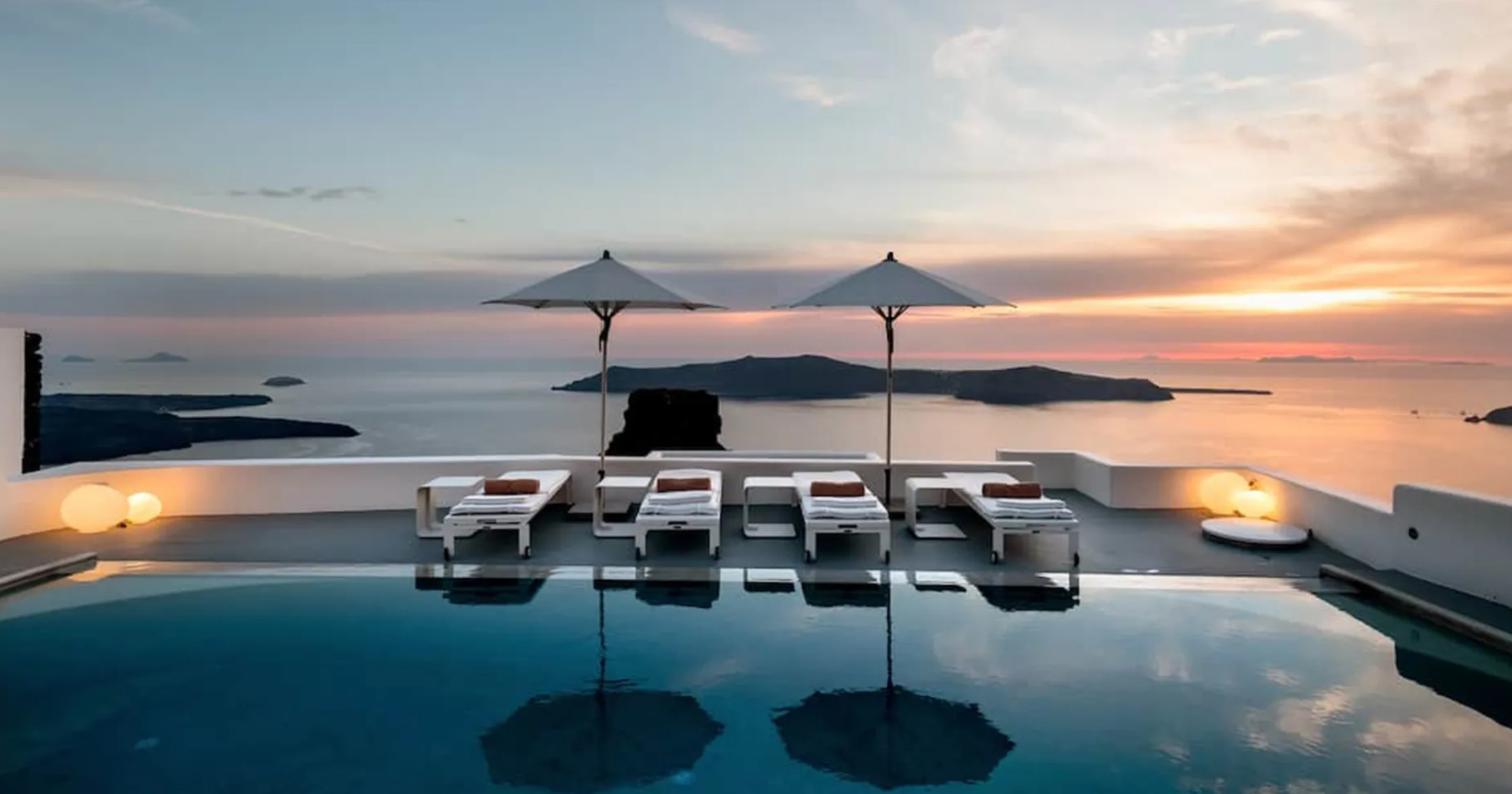 Dramatic caldera sunset from Grace Hotel Santorini’s 363 Champagne Lounge – secure the best rates via CountryClubuk