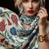 Fox & Chave Iznik Flowers pure silk habotai scarf modeled on a woman, featuring vibrant red tulips and blue carnations on white background