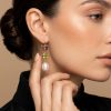 Woman wearing 14K yellow gold amethyst peridot pearl drop earrings