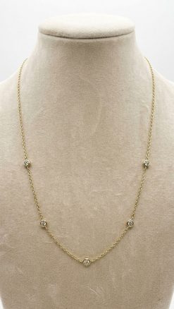 Close-up of bezel-set natural diamonds on Effy 14ct gold station necklace showing craftsmanship and sparkle