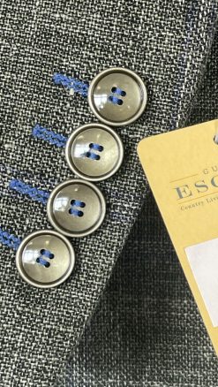 Close-up of four-button cuff with contrast stitching on Gurteen Florence sage check jacket