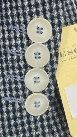 Close-up of mother-of-pearl buttons and four-button cuffs on Gurteen Monza indigo check jacket