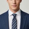 Men’s navy and silver diagonal striped pure silk tie styled with blue suit and white shirt