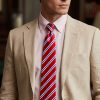 Red white and blue striped pure silk tie worn with pale pink shirt and beige suit – classic British Savile Row inspired power stripe tie for men
