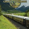 Venice Simplon-Orient-Express luxury train travelling through spectacular spring Alpine scenery on the Paris to Venice route.