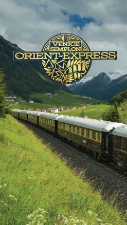 Venice Simplon-Orient-Express luxury train travelling through spectacular spring Alpine scenery on the Paris to Venice route.
