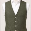 Pure linen waistcoat by Gurteen in olive green, crafted for refined summer tailoring and relaxed country-house style.