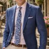 The Viago blue linen jacket by Gurteen styled for relaxed summer tailoring and country village occasions
