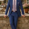 The Viago blue linen jacket by Gurteen styled for relaxed summer tailoring and country village occasions