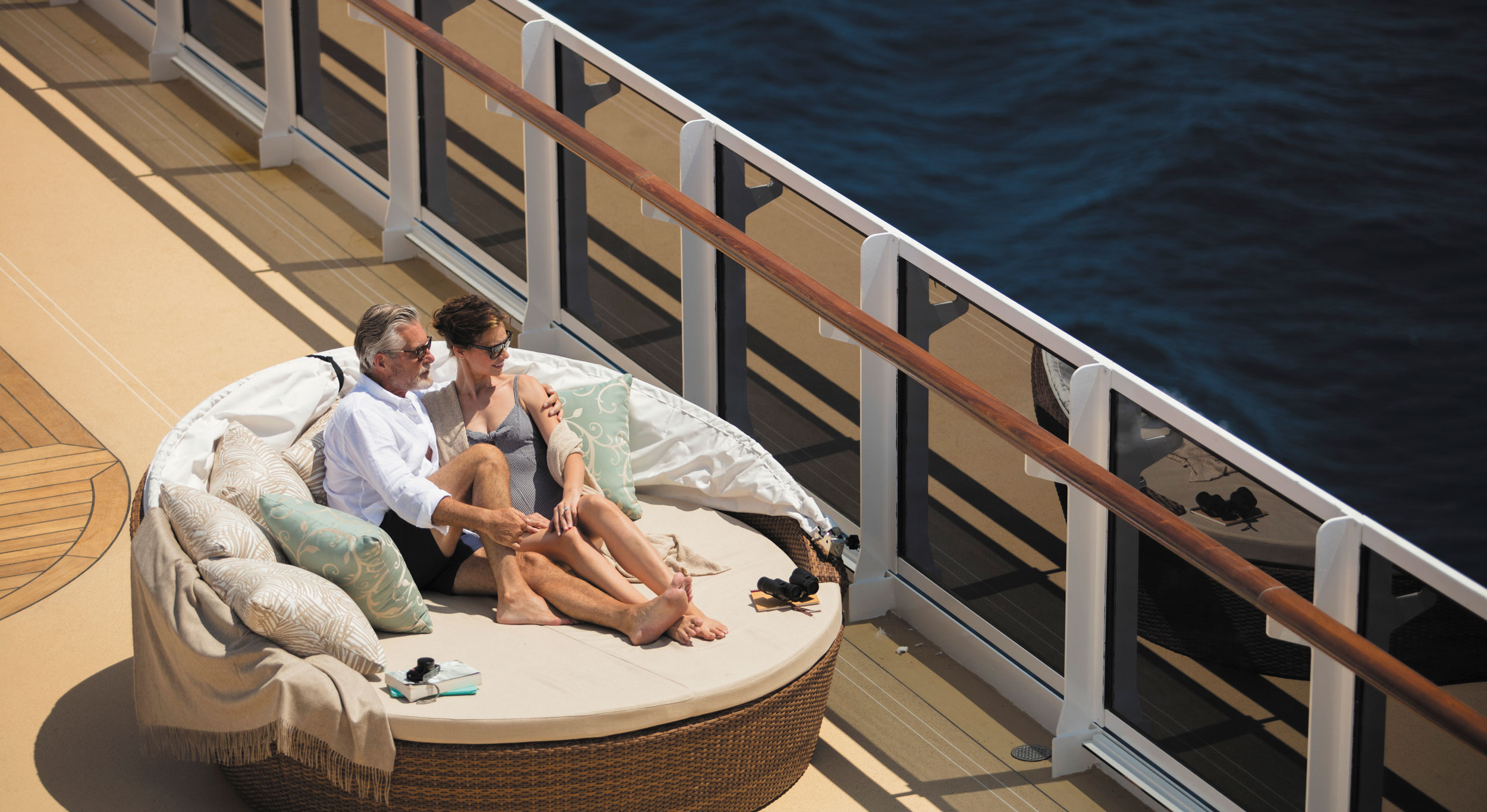 Guests relaxing on deck aboard Seven Seas Prestige