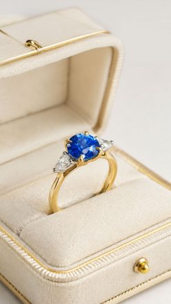 Natural Ceylon blue sapphire ring with marquise-cut diamonds in platinum and yellow gold by CountryClubuk