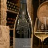 Domaine Giraud Châteauneuf-du-Pape Blanc Les Galimardes 2024 bottle and glass in a wine cellar