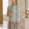 Model wearing Fox & Chave Morris Seaweed silk scarf with contrasting Evenlode floral borders